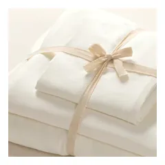 Cream bedding set tied with a ribbon